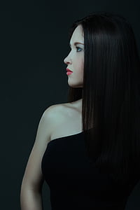 woman wearing black top looking at her right side thumbnail