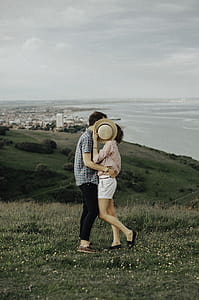 Photo of Woman and Man Hugging While Standing on Grass thumbnail