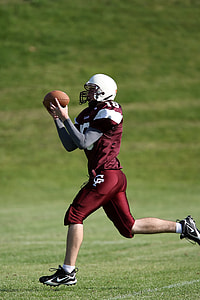 man playing football playing on field thumbnail