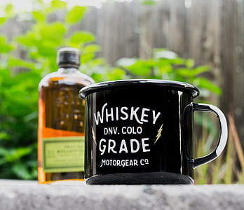 black and white ceramic mug on gray concrete surface thumbnail