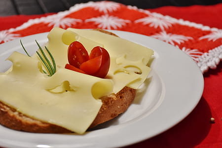 selective focus photo of cheese and bread in plate thumbnail