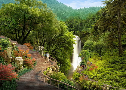 man and woman walking down the park near waterfalls thumbnail