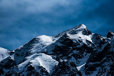 snow covered mountain under white sky thumbnail