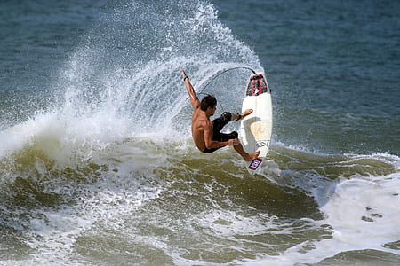 man surfing on raging water thumbnail