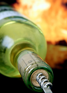 gray stainless steel crew screw on green labeled bottle close-up photography thumbnail
