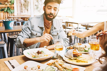 man sitting in front of foods thumbnail