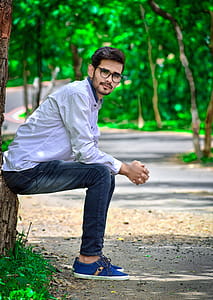 Man Sitting on Tree Trunk thumbnail