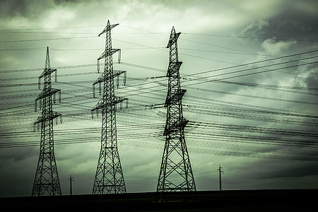 three black metal electricity towers thumbnail