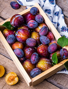 round fruits on brown wooden box thumbnail