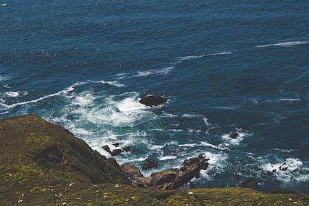 aerial photography of sea beside cliff thumbnail
