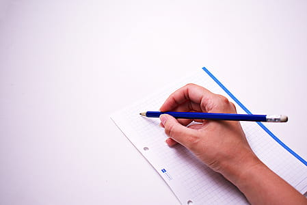 Person Writing On White Paper thumbnail