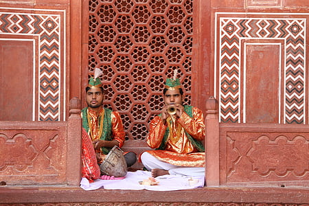 two male sitting in front of door thumbnail