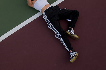 woman lying on red and green floor thumbnail