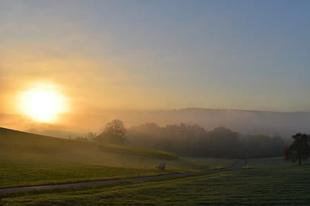 landscape photography of farm land under sunset thumbnail