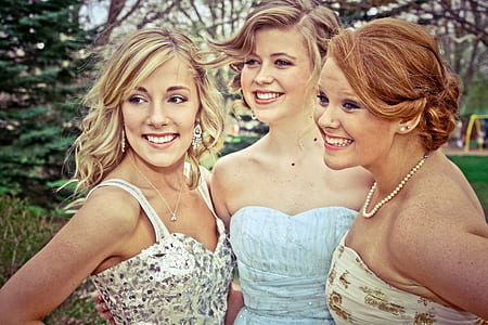 three woman taking a photo thumbnail