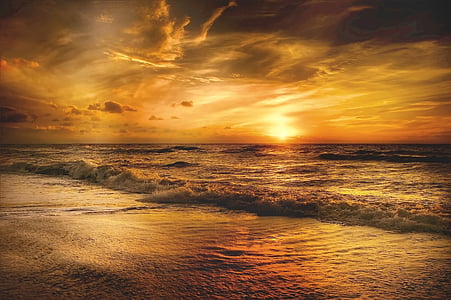 sunset over beach shore thumbnail
