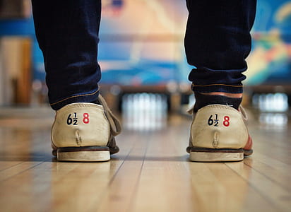 person wearing pair of beige low-top lace-up shoes thumbnail