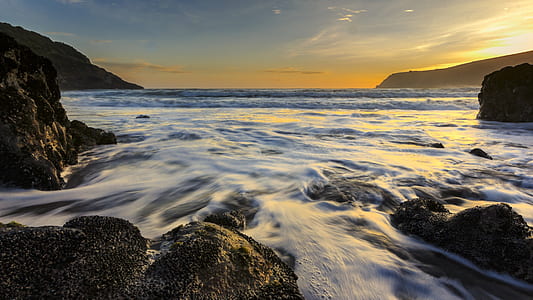 time lapse photo of body of water thumbnail