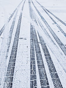 vehicle trails on white surface thumbnail