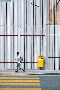 man walking alone on pathway thumbnail