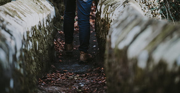 man standing between concrete rail thumbnail
