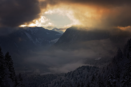 photo of mountain during cloudy day time thumbnail