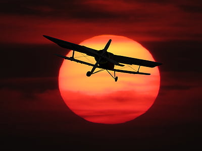 silhouette photography of monoplane thumbnail