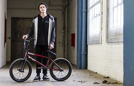 man holding BMX bike thumbnail