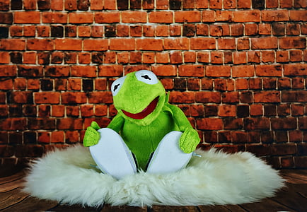 Kermit the frog plush toy sitting on fur textile thumbnail