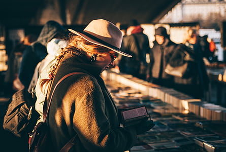woman holding book thumbnail