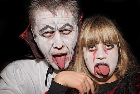 man and woman in Halloween costume thumbnail