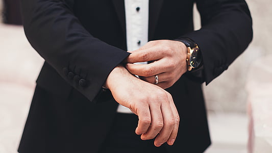 selective focus photography of person in black shirt folding sleeve thumbnail