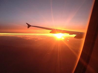 airplane wing during golden hour thumbnail