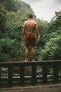 man standing on bridge thumbnail