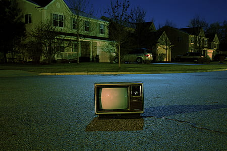 vintage TV on gray cement road thumbnail