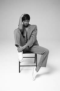 Woman Sitting On Metal Chair thumbnail