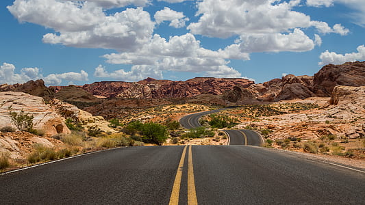 black asphalt road on broad daylight thumbnail