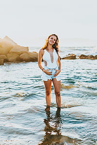 woman standing on seashore thumbnail