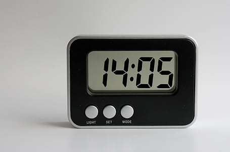 rectangular black and white digital clock displaying at 14:05 thumbnail