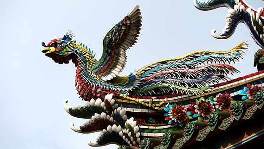 white, yellow, red, and blue bird statue thumbnail