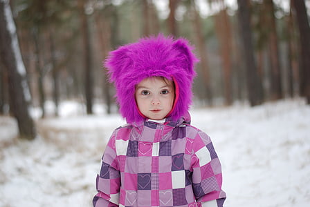 toddler wearing purple hat thumbnail