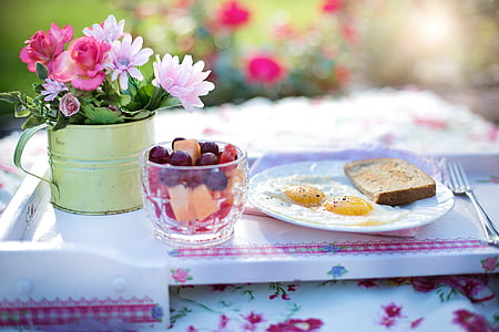bread and egg on plate during daytime thumbnail