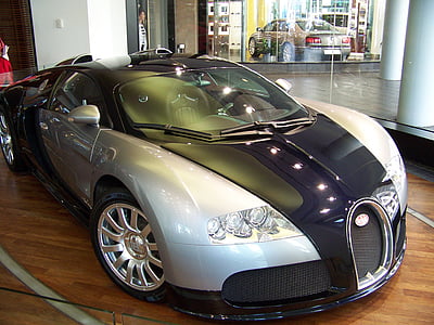 silver and blue Bugatti Veyron parked inside building thumbnail