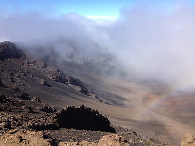 volcano crater filled with smoke during daytime thumbnail