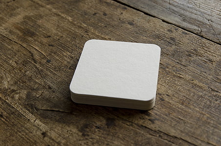 square white card on brown wooden board thumbnail