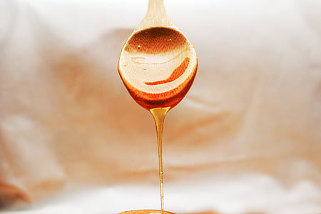 selective photography of dropped honey thumbnail