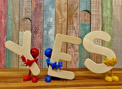 figures holding freestanding letters thumbnail