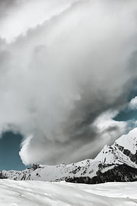 white snowy mountain under white clouds thumbnail