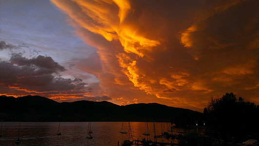 white sailing boats on body of water during sun set thumbnail