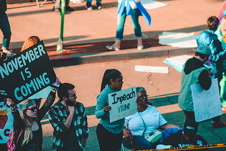 Woman Holding Sign Board With Impeach Print thumbnail
